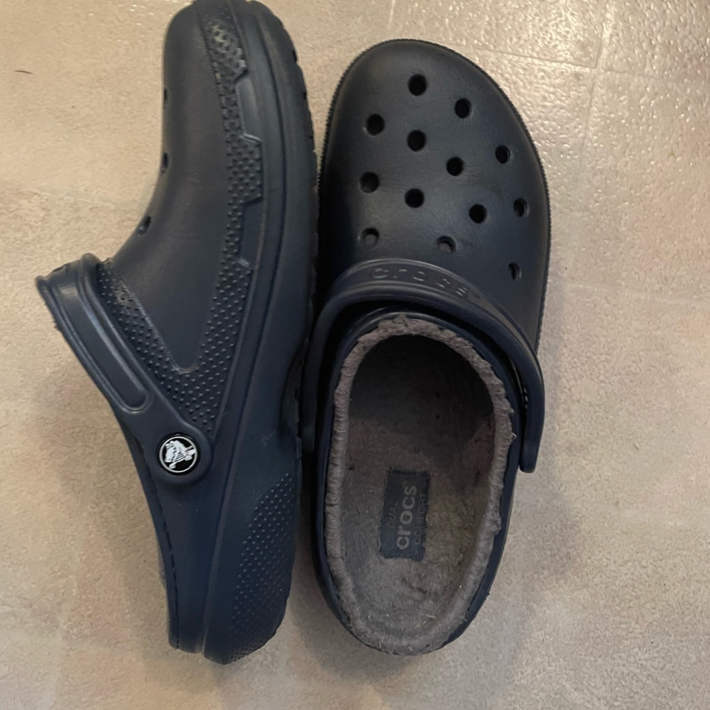 Blue crocs with gray lining. Women’s size 10 men’s size 8.